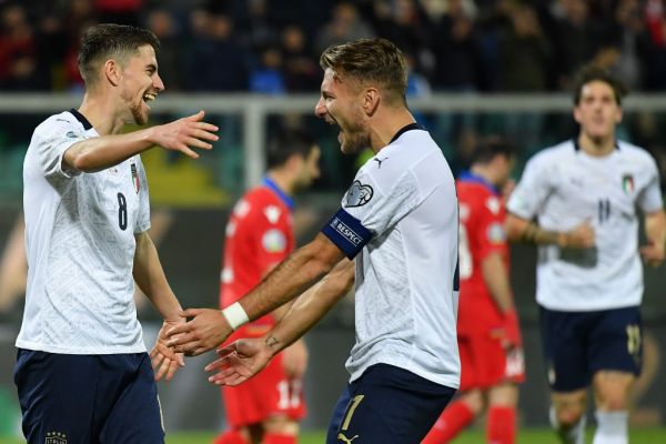 Italy's midfielder Jorginho (L) celebrates with Italy's forward Ciro Immobile after scoring during the Euro 2020 1st round Group J qualifying football match Italy v Armenia on November 18, 2019 at the Renzo-Barbera stadium in Palermo. PHOTO | AFP