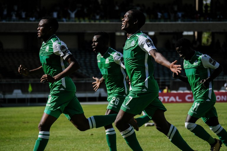 Jacques Tuyisenge of Kenya's Gor Mahia (C, below) celebrates with Batambuze Shafik (C, above) after scoring his second goal during their CAF Confereration cup football match against Egypt's Zamalek at The Kasarani Stadium in Nairobi on February 3, 2019. Kenya's Gor Mahia won by 4-2 against Egypt's Zamalek. PHOTO/AFP