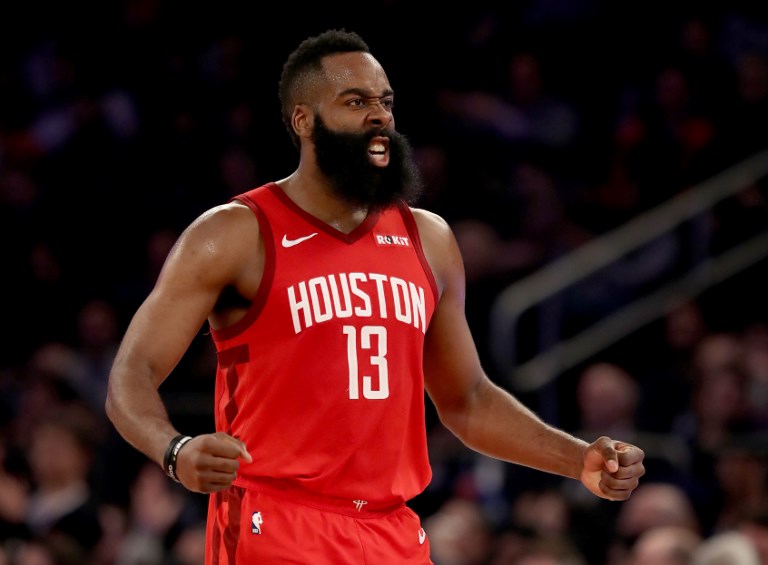 James Harden #13 of the Houston Rockets celebrates after teammate Gerald Green dunked in the third quarter against the New York Knicks at Madison Square Garden on January 23, 2019 in New York City. PHOTO/AFP