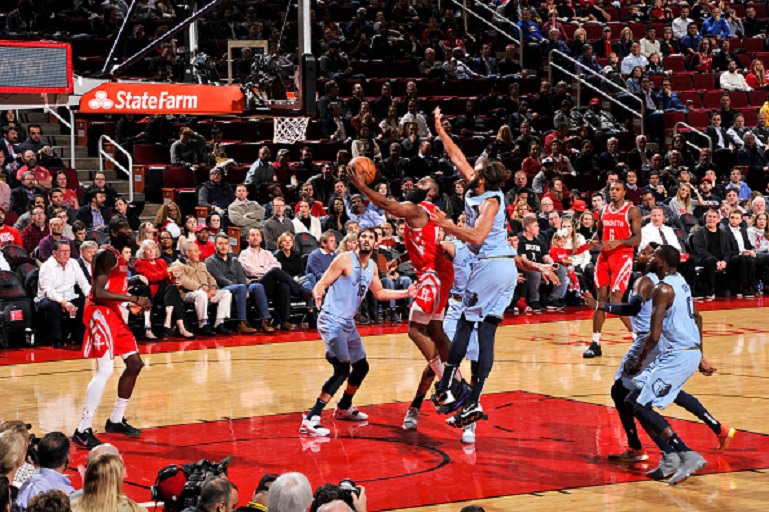 James Harden #13 of the Houston Rockets drives to the basket during the game against Joakim Noah #55 of the Memphis Grizzlies on January 14, 2019 at the Toyota Center in Houston, Texas. PHOTO/GettyImages