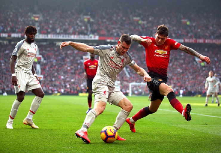 James Milner of Liverpool battles for possession with Victor Lindelof of Manchester United during the Premier League match between Manchester United and Liverpool FC at Old Trafford on February 24, 2019 in Manchester, United Kingdom. PHOTO/GettyImages