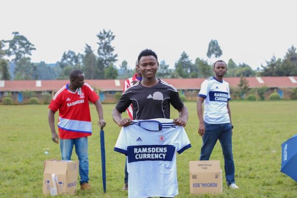 James Ngige of Dust Raisers FC  display his Kit For Africa jersey ahead of their Joshua Mburu Football Tournament finals on Sunday against Kiambaa FC at Kimende Primary School in Lari, Kiambu County on June 20, 2019. PHOTO/SPN