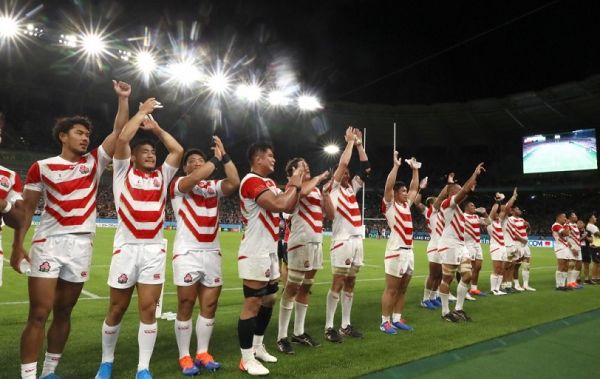 Japan's team players celebrate after beating Ireland of the Rugby World Cup Pool A match at Shizuoka Stadium Ecopa in Fukuroi in Shizuoka Prefecture on Sept. 28, 2019. Japan defeated Ireland 19-12. PHOTO | AFP