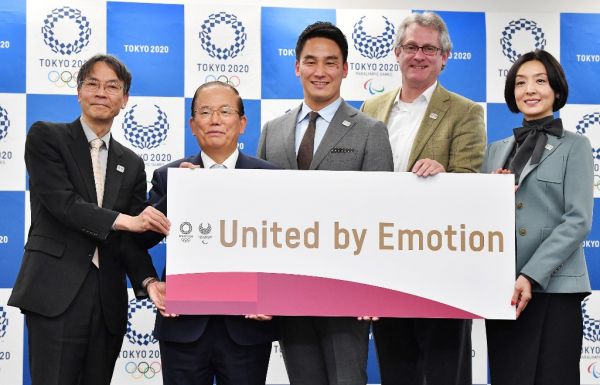 Japanese actor Tamiyo Kusakari (R), Paralympics swimmer Takeshi Matsuda and others holds a banner that the motto of Tokyo Olympics and Paralympics in Tokyo on Feb. 17, 2020. The Tokyo Organising Committee of the Olympic and Paralympic Games unveiled the motto, United by Emotion. PHOTO | AFP