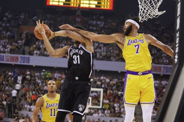 Jarret Allen of the Brooklyn Nets (L) and JaVale McGee of the Los Angeles Lakers compete for the ball during the National Basketball Association (NBA) pre-season match between the Los Angeles Lakers and Brooklyn Nets in Shenzhen, in China's southern Guangdong province on October 12, 2019. PHOTO | AFP