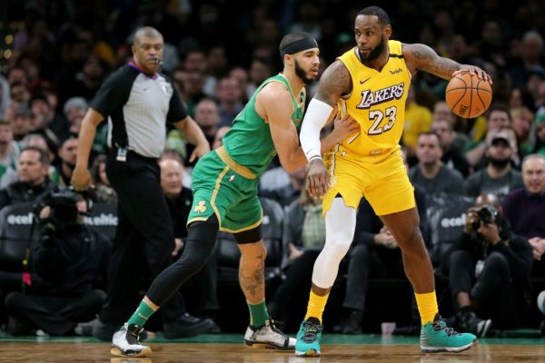 Jayson Tatum #0 of the Boston Celtics defends LeBron James #23 of the Los Angeles Lakers at TD Garden on January 20, 2020 in Boston, Massachusetts. The Celtics defeat the Lakers 139-107. PHOTO | AFP