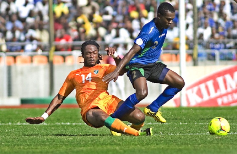 Jean Jacques Gosso of Ivory Coast vies for the ball with Salum Abubakar of Tanzania's Taifa Stars on June 16, 2013 during their 2014 World Cup qualifying match in the Tanzanian capital Dar es Salaam. AFP PHOTO/Tony KARUMBA .PHOTO/GETTY IMAGES