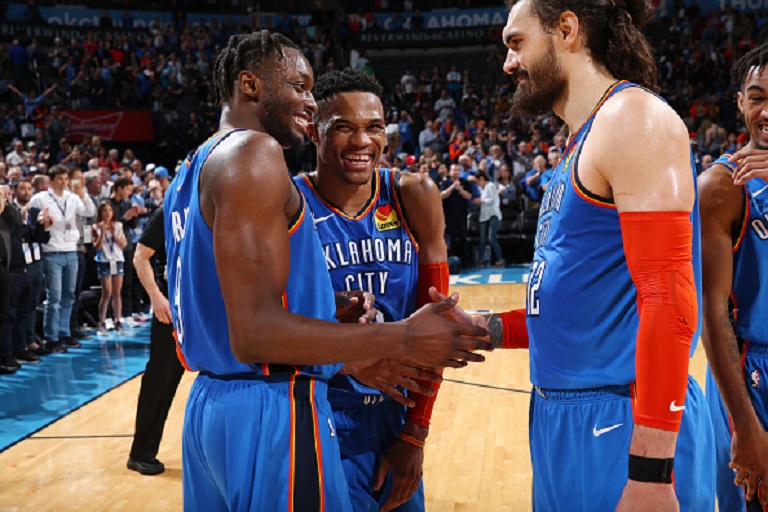 Jerami Grant #9, Russell Westbrook #0 and Steven Adams #12 of the Oklahoma City Thunder celebrates after the game against the Indiana Pacers on March 27, 2019 at the Chesapeake Energy Arena in Boston, Massachusetts. PHOTO/ GETTY IMAGES