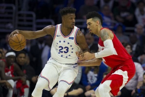 Jimmy Butler #23 of the Philadelphia 76ers dribbles the ball against Danny Green #14 of the Toronto Raptors in the first quarter of Game Six of the Eastern Conference Semifinals at the Wells Fargo Center on May 9, 2019 in Philadelphia, Pennsylvania. The 76ers defeated the Raptors 112-101. PHOTO/AFP