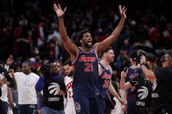 Joel Embiid #21 of the Philadelphia 76ers waves after defeating the Toronto Raptors in Game Three of the Eastern Conference First Round at Scotiabank Arena on April 20, 2022 in Toronto, Canada. PHOTO | AFP