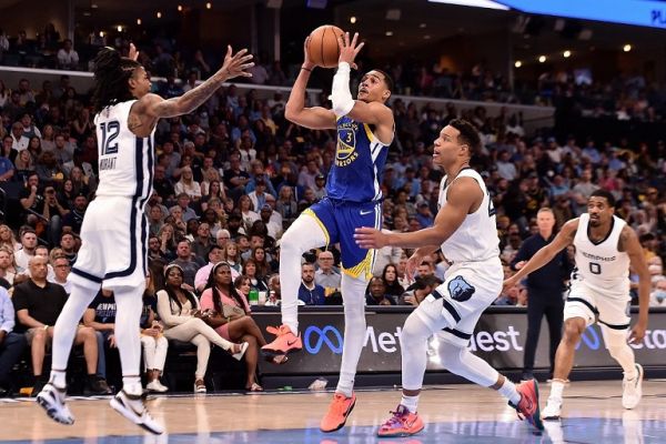 Jordan Poole #3 of the Golden State Warriors goes to the basket against Ja Morant #12 of the Memphis Grizzlies during Game One of the Western Conference Semifinals of the NBA Playoffs at FedExForum on May 01, 2022 in Memphis, Tennessee. PHOTO | AFP
