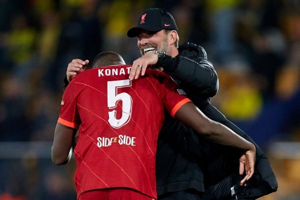 Jurgen Klopp (R) head coach of Liverpool FC celebrates the victory with Ibrahima Konate of Liverpool FC after the UEFA Champions League Semifinal Second Leg match between Villarreal CF and Liverpool FC at Estadio de la Ceramica, May 3, 2022, Villarreal, Spain. PHOTO | AFP