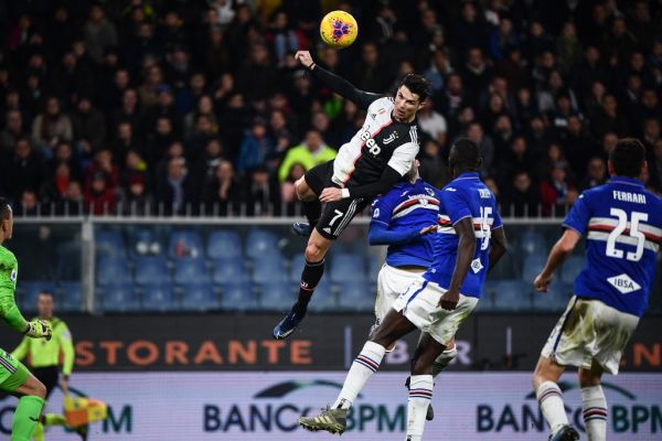 Juventus' Portuguese forward Cristiano Ronaldo (C) scores a header during the Italian Serie A football match Sampdoria vs Juventus on December 18, 2019 at the Luigi-Ferraris stadium in Genoa. PHOTO | AFP