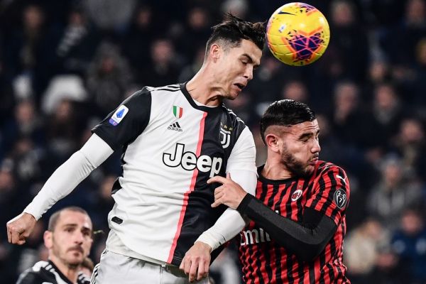 Juventus' Portuguese forward Cristiano Ronaldo (L) and AC Milan's French defender Theo Hernandez go for a header during the Italian Serie A football match Juventus vs AC Milan on November 10, 2019 at the Juventus Allianz stadium in Turin. PHOTO |AFP