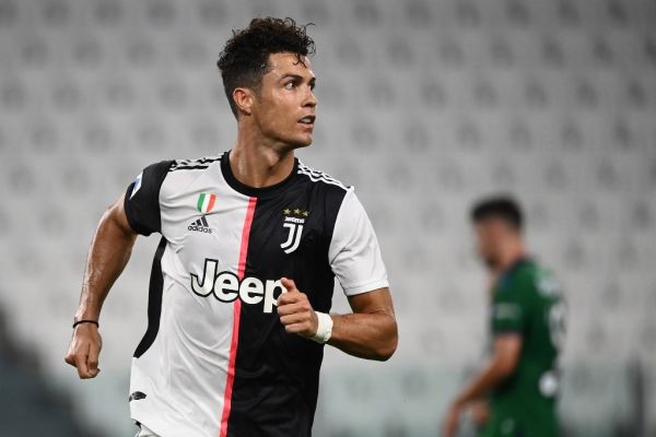 Juventus' Portuguese forward Cristiano Ronaldo celebrates after scoring his second penalty during the Italian Serie A football match Juventus Turin vs Atalanta Bergamo played behind closed doors on July 11, 2020 at the Juventus stadium in Turin, as the country eases its lockdown aimed at curbing the spread of the COVID-19 infection, caused by the novel coronavirus. PHOTO | AFP