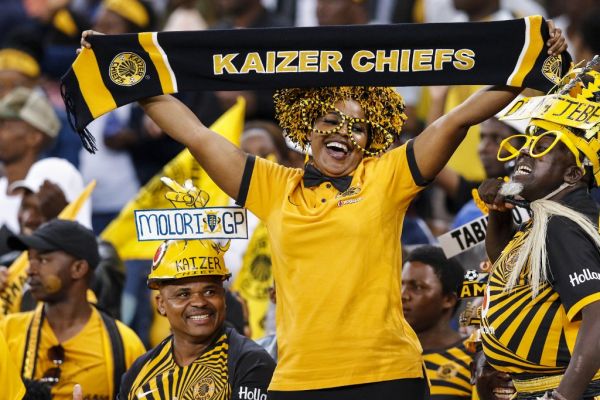 Kaizer chief's supporters cheer for their team during the Premier Soccer League (PSL) match between Kaizer Chiefs and Bloemfontein Celtic at the Moses Mabhida Stadium, in Durban, on December 7, 2019. PHOTO | AFP