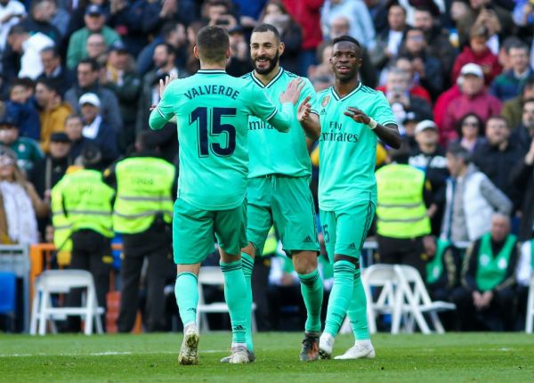 Karim Benzema of Real Madrid celebrates a goal with Fede Valverde during the Spanish championship La Liga football match between Real Madrid and Espanyol on December 07, 2019 at Santiago Bernabeu stadium in Madrid, Spain. PHOTO | AFP