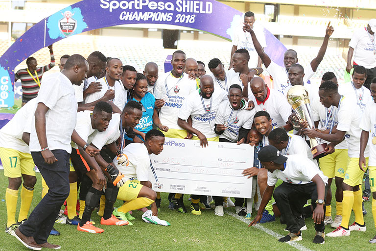 Kariobangi Sharks FC players and staff celebrate with the 2018 SportPesa Shield trophy and KSh2m dummy cheque following their 3-2 victory over Sofapaka FC at the MISC, Kasarani on Saturday, October 20, 2018. PHOTO/Stafford Ondego/www.sportpicha.com