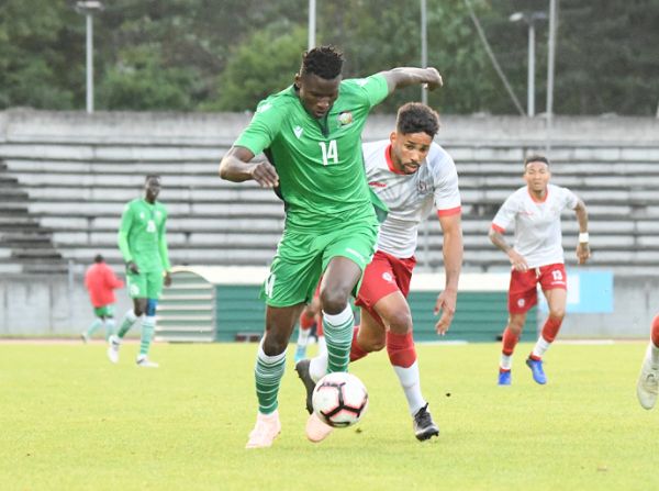 Kashiwa Reysol forward Michael Olunga (in green) challenges opponent during Kenya vs Madagascar friendly match at Stade Robert Bobin Stadium in Paris on June 7, 2019. PHOTO/ FKF