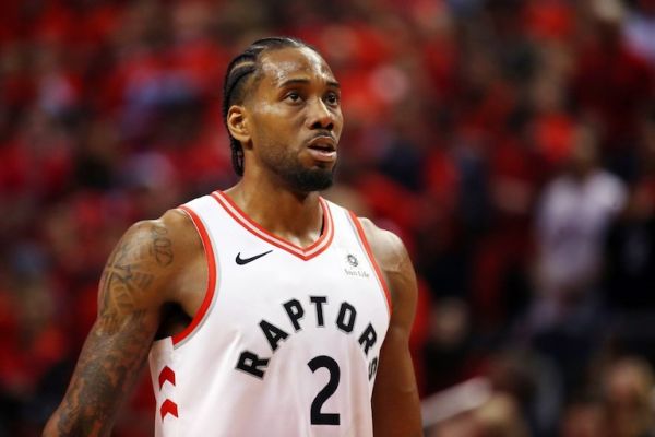 Kawhi Leonard #2 of the Toronto Raptors reacts in the first half against the Golden State Warriors during Game Five of the 2019 NBA Finals at Scotiabank Arena on June 10, 2019 in Toronto, Canada. Kawhi Leonard is going home to play for the Los Angeles Clippers, reportedly agreeing to a multi-million dollar deal less than a month after leading the Toronto Raptors to their first championship. PHOTO/AFP