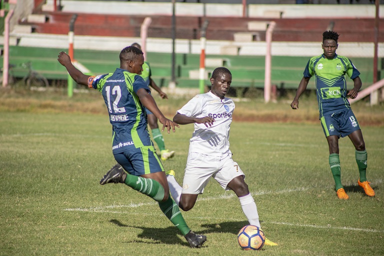 KCB defender Mike Kibwage contests the ball with AFC Leopards SC midfielder Brian Marita during the SportPesa Premier League match at the Afraha Stadium in Nakuru on Saturday, January 12, 2019. PHOTO/SPN