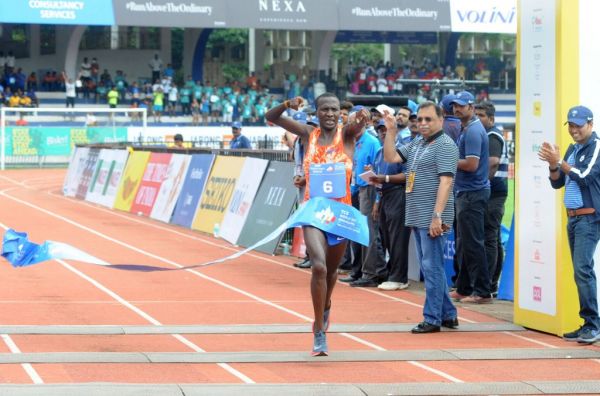 Kenya’s Alex Korio crosses the finish line in 00:28:12 seconds to win the overall men’s title at the TCS World 10K run in Bengaluru, on May 21, 2017. PHOTO | AFP