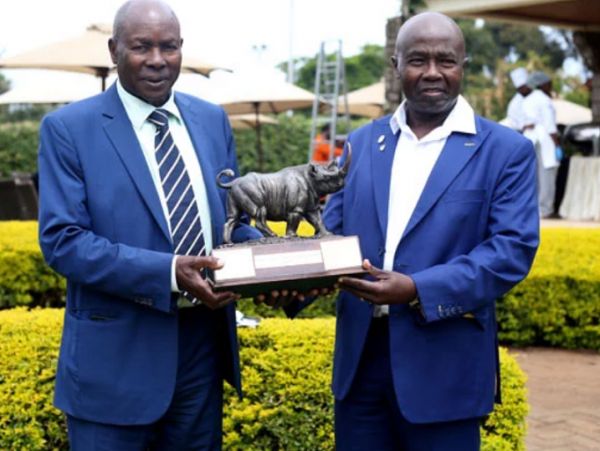Kenya Open Golf Limited Chairman Peter Kanyago (left) and tournament director Patrick Obath hold the winners award during media briefing on this year's Magical Kenya Open presented by ABSA at the Karen Country club on March 2, 2020. PHOTO | SILA KIPLAGAT | NATION MEDIA GROUP 