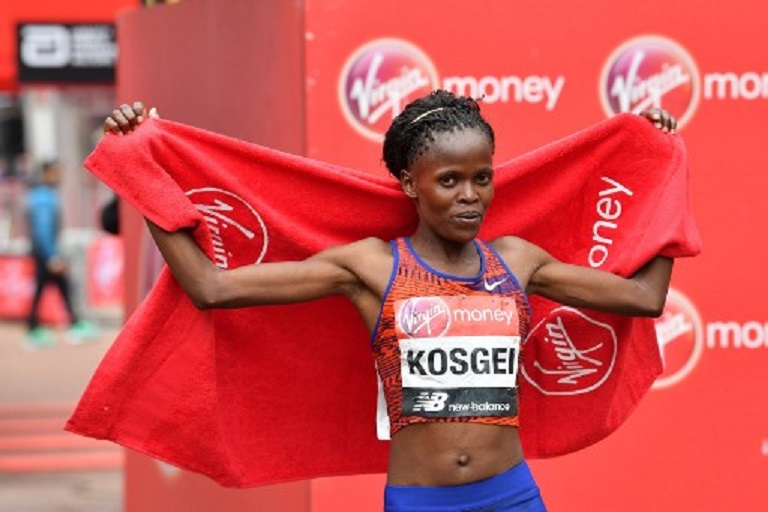 Kenya's Brigid Kosgei poses for a photograph after winning the elite women's race of the 2019 London Marathon in central London on April 28, 2019. PHOTO/AFP