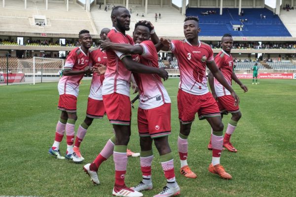 Kenya's Erick Ouma Otieno (C) celebrates with his teammates after scoring during a friendly football match against Malawi at Kasarani Stadium in Nairobi, on September 11, 2018. PHOTO | AFP