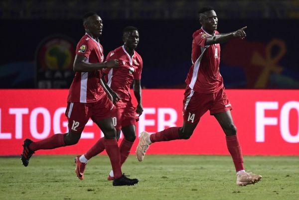 Kenya's forward Michael Olunga (R) celebrates scoring his team's third goal during the 2019 Africa Cup of Nations (CAN) football match between Kenya and Tanzania at the Stadium in Cairo on June 27, 2019. PHOTO/AFP