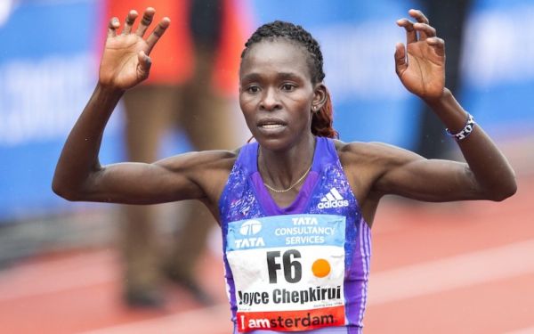 Kenya's Joyce Chepkirui celebrates after crossing the finish line to win the Amsterdam Marathon 2015 in Amsterdam, The Netherlands, on October 18, 2015. PHOTO/AFP