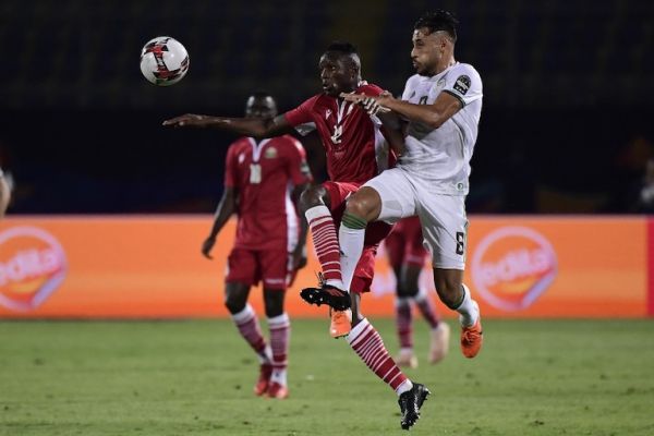 Kenya's midfielder Victor Wanyama (L) fights for the ball with Algeria's forward Youcef Belaili during the 2019 Africa Cup of Nations (CAN) football match between Algeria and Kenya at the 30 June Stadium in Cairo on June 23, 2019. PHOTO/AFP