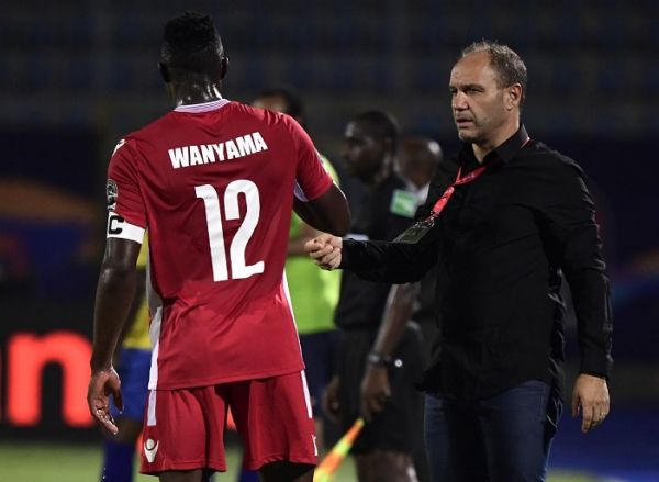 Kenya's midfielder Victor Wanyama (L) receives instructions from Kenya's coach Sebastian Migne during the 2019 Africa Cup of Nations (CAN) football match between Kenya and Tanzania at the Stadium in Cairo on June 27, 2019. PHOTO | AFP