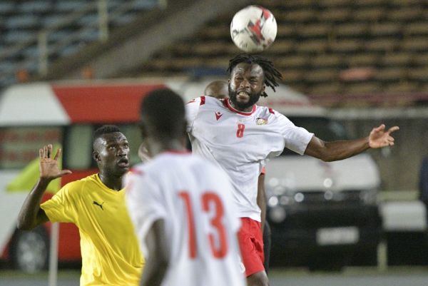 Kenya's national side, Harambee Star's Johanna Omollo(R) headers the ball as Togo's Adewale James (L) approaches November 18, 2019 during their African Cup of Nations (AFCON) qualifier football match in Nairobi. PHOTO | AFP