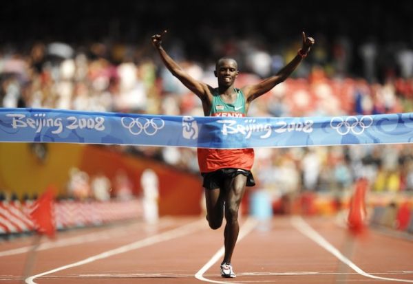 Kenya's Samuel Kamau Wanjiru crosses the finish line in the men's marathon at the Bird's Nest National Stadium during the 2008 Beijing Olympic Games on August 24, 2008. Wanjiru won the men's marathon title, giving Kenya their first ever-Olympic gold in the event. PHOTO/AFP