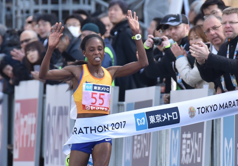 Kenya's Sarah Chepchirchir crosses the finish line in the women's category of the Tokyo Marathon in Tokyo on February 26, 2017. PHOTO/AFP