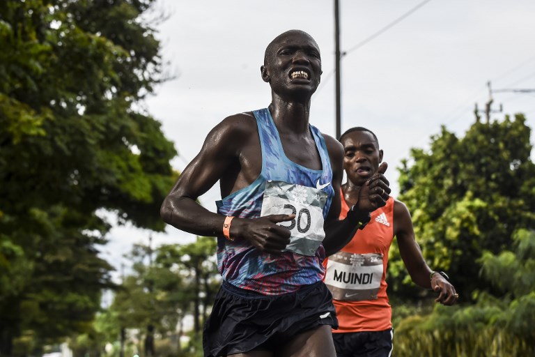 Kenyan athletes Joseph Kiprono (L) and Daniel Muindi run the 21km race at the Medellin Flowers Marathon, in the Colombian city of Medellin on September 16, 2018. Kiprono was hit by a car as he was leading the race 1.5km prior to the finish line and was taken to hospital while Muindi won the race with a time of 1:03:45. More than 15,000 runners took part in four different running events. PHOTO/AFP