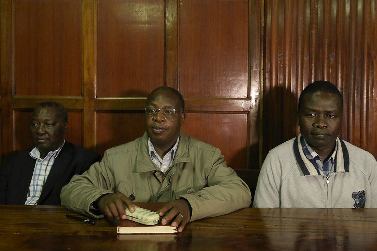Kenyan former sports principal secretary, Richard Ekai (R), former head of mission for the Rio Olympic Games, Stephen Soi (C), and Kenya's national Olympic committee secretary general, Francis Kanyili, sit at a Nairobi court in Kenya, October 15, 2018, to answer alleged charges of corruption during the 2016 Olympics in Rio de Janeiro. PHOTO/AFP