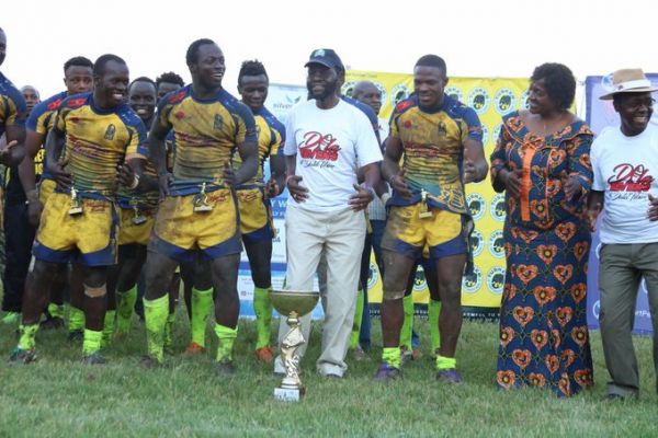 Kisumu County Governor, Prof. Anyang' Nyong'o does a jig with Homeboyz RFC players when they won the Dala 7s in the lake side city last season. PHOTO/File