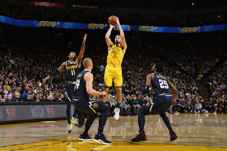 Klay Thompson #11 of the Golden State Warriors shoots the ball against the Denver Nuggets on March 8, 2019 at ORACLE Arena in Oakland, California. PHOTO/GettyImages