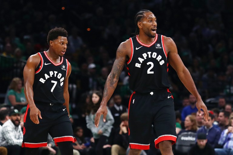 Kyle Lowry #7 and Kawhi Leonard #2 of the Toronto Raptors look on during the first half against the Boston Celtics at TD Garden on November 16, 2018 in Boston, Massachusetts. PHOTO/AFP