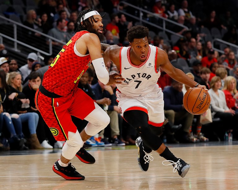 Kyle Lowry #7 of the Toronto Raptors drives against DeAndre' Bembry #95 of the Atlanta Hawks at State Farm Arena on November 21, 2018 in Atlanta, Georgia. PHOTO/AFP