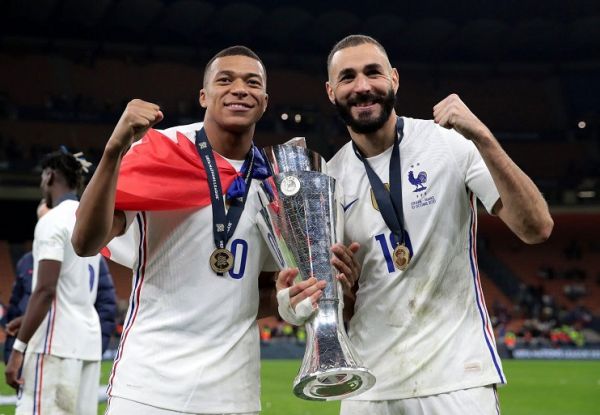 Kylian Mbappe and Karim Benzema of France celebrate with The UEFA Nations League trophy following victory in the UEFA Nations League 2021 Final match between Spain and France at San Siro Stadium on October 10, 2021 in Milan, Italy. PHOTO | Alamy