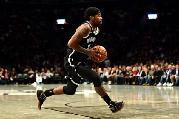 Kyrie Irving #11 of the Brooklyn Nets conrols the ball during the first half of their game against the New York Knicks at Barclays Center on October 25, 2019 in the Brooklyn borough of New York City. PHOTO/ GETTY IMAGES