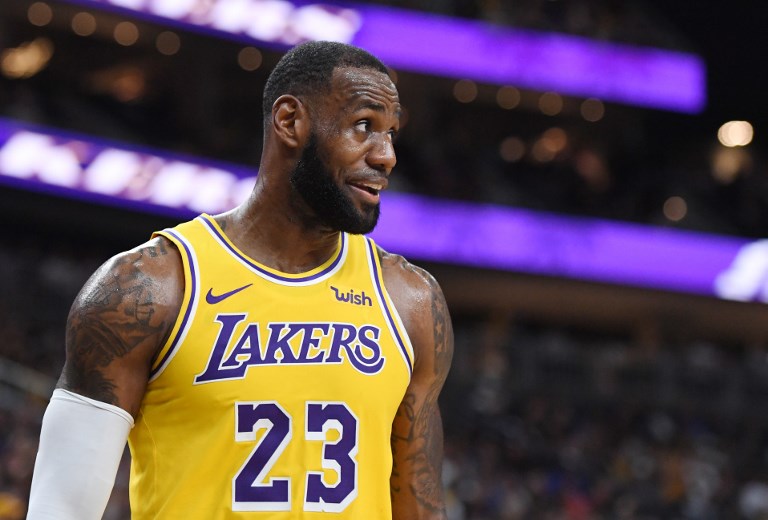 LAS VEGAS, NEVADA - OCTOBER 10: LeBron James #23 of the Los Angeles Lakers walks on the court during a stop in play in a preseason game against the Golden State Warriors at T-Mobile Arena on October 10, 2018 in Las Vegas, Nevada. The Lakers defeated the Warriors 123-113. PHOTO/AFP