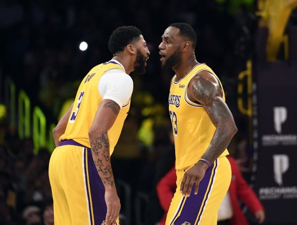 LeBron James #23 is congratulated by Anthony Davis #3 of the Los Angeles Lakers after scoring a basket against Memphis Grizzlies during the second half at Staples Center on October 29, 2019 in Los Angeles, California. PHOTO | AFP