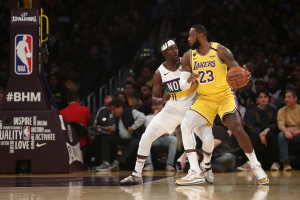 LeBron James #23 of the Los Angeles Lakers handles the ball against Jrue Holiday #11 of the New Orleans Pelicans during the first half at Staples Center on February 25, 2020 in Los Angeles, California. PHOTO | AFP