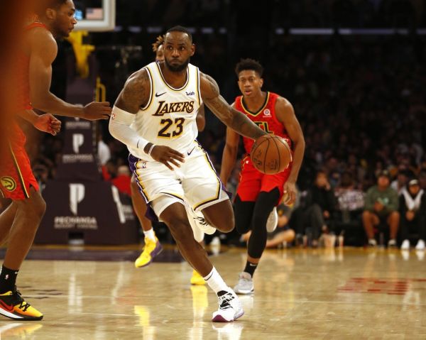 LeBron James #23 of the Los Angeles Lakers moves the ball down the court during the second half of a game against the Atlanta Hawks at Staples Center on November 17, 2019 in Los Angeles, California. PHOTO | AFP