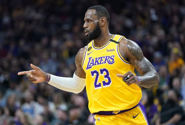 LeBron James #23 of the Los Angeles Lakers reacts after his team scored against the Sacramento Kings during the first half of an NBA basketball game at Golden 1 Center on February 01, 2020 in Sacramento, California. PHOTO \ AFP