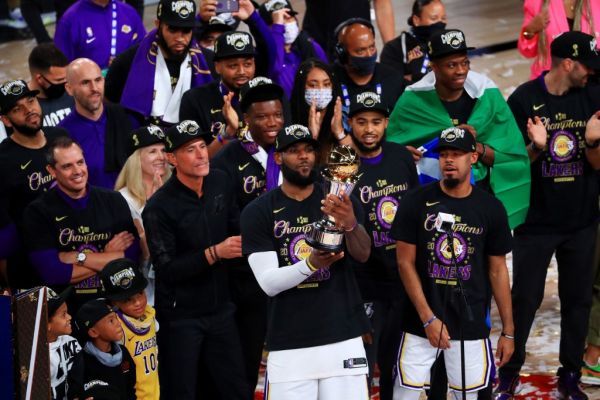 LeBron James #23 of the Los Angeles Lakers reacts with the trophy after winning the 2020 NBA Championship over the Miami Heat in Game Six of the 2020 NBA Finals at AdventHealth Arena at the ESPN Wide World Of Sports Complex on October 11, 2020 in Lake Buena Vista, Florida. PHOTO | AFP